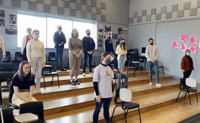 Picture of Holy Heart Chamber Choir singers in school classroom with masks on and distanced